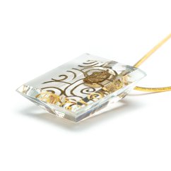 Cut clear glass jewelry with gold spirals