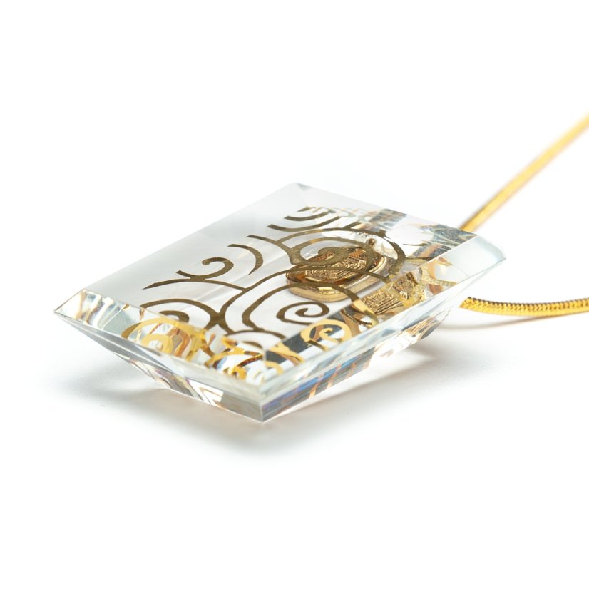 Cut clear glass jewelry with gold spirals